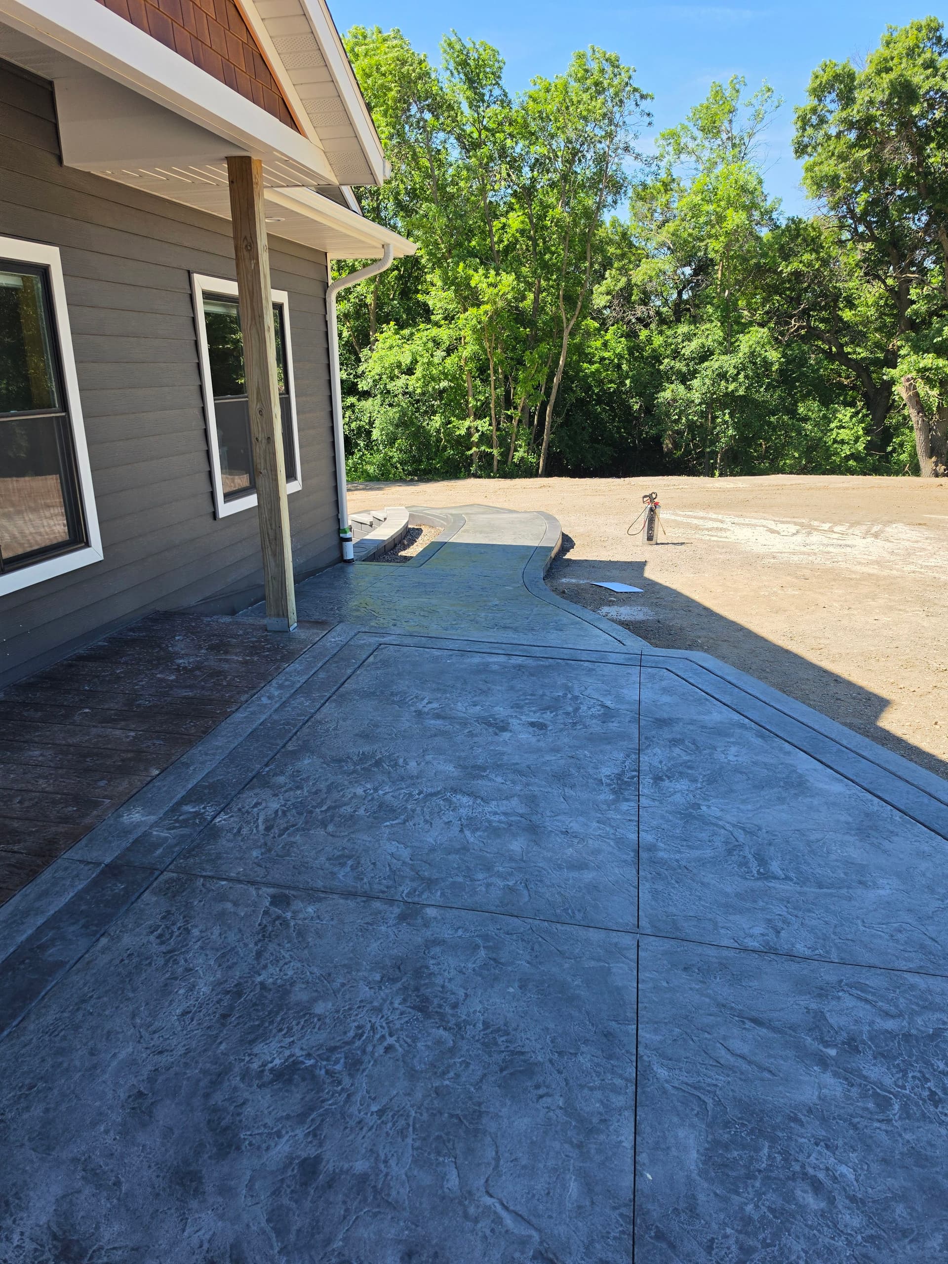 Gallery photos for Stamped Patios, Steps, Borders, and a Broom-Finish Driveway Built as One: Image #2