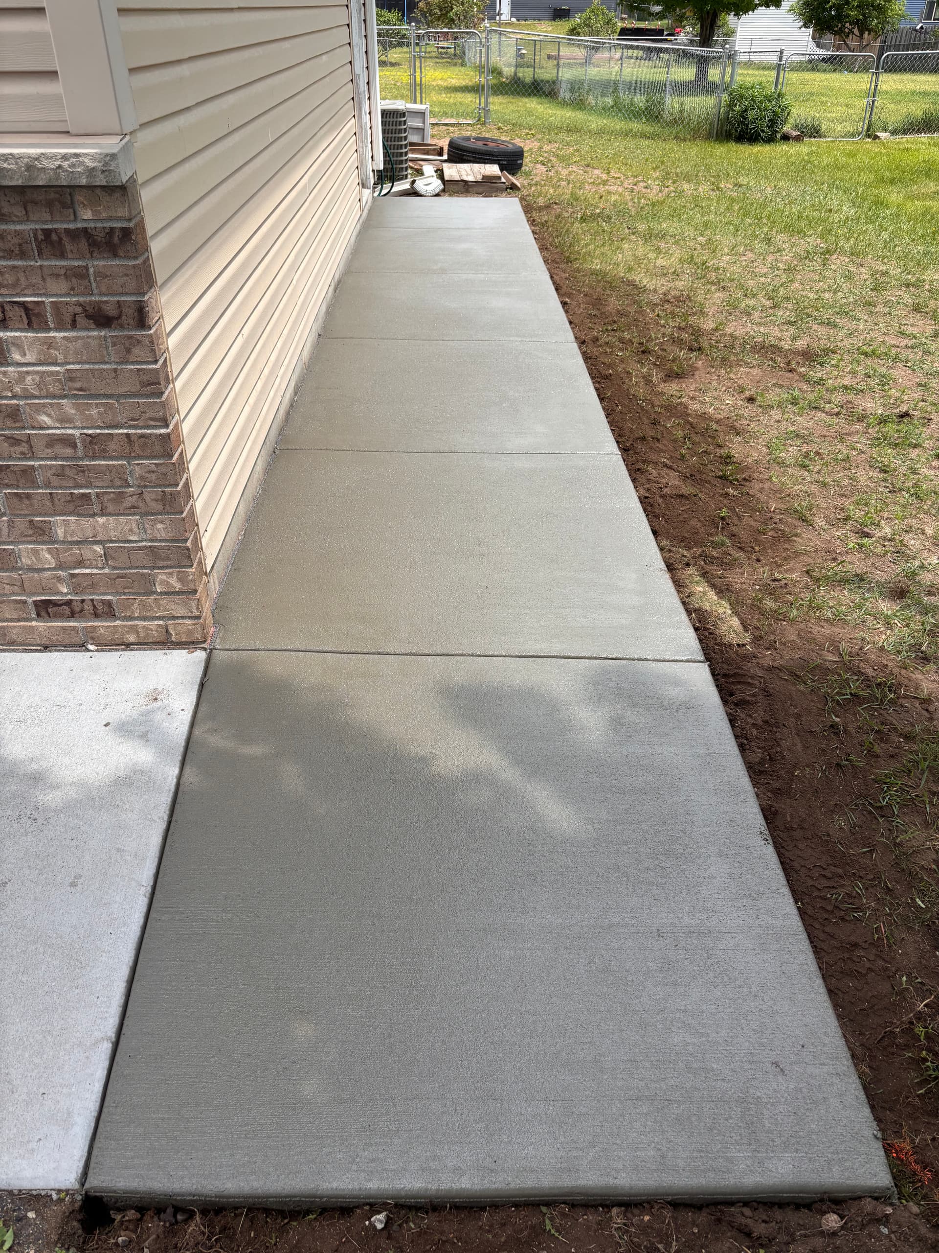 Gallery photos for Fresh Concrete Aprons, Door Pads, and Sidewalk Extensions Done Right: Image #3