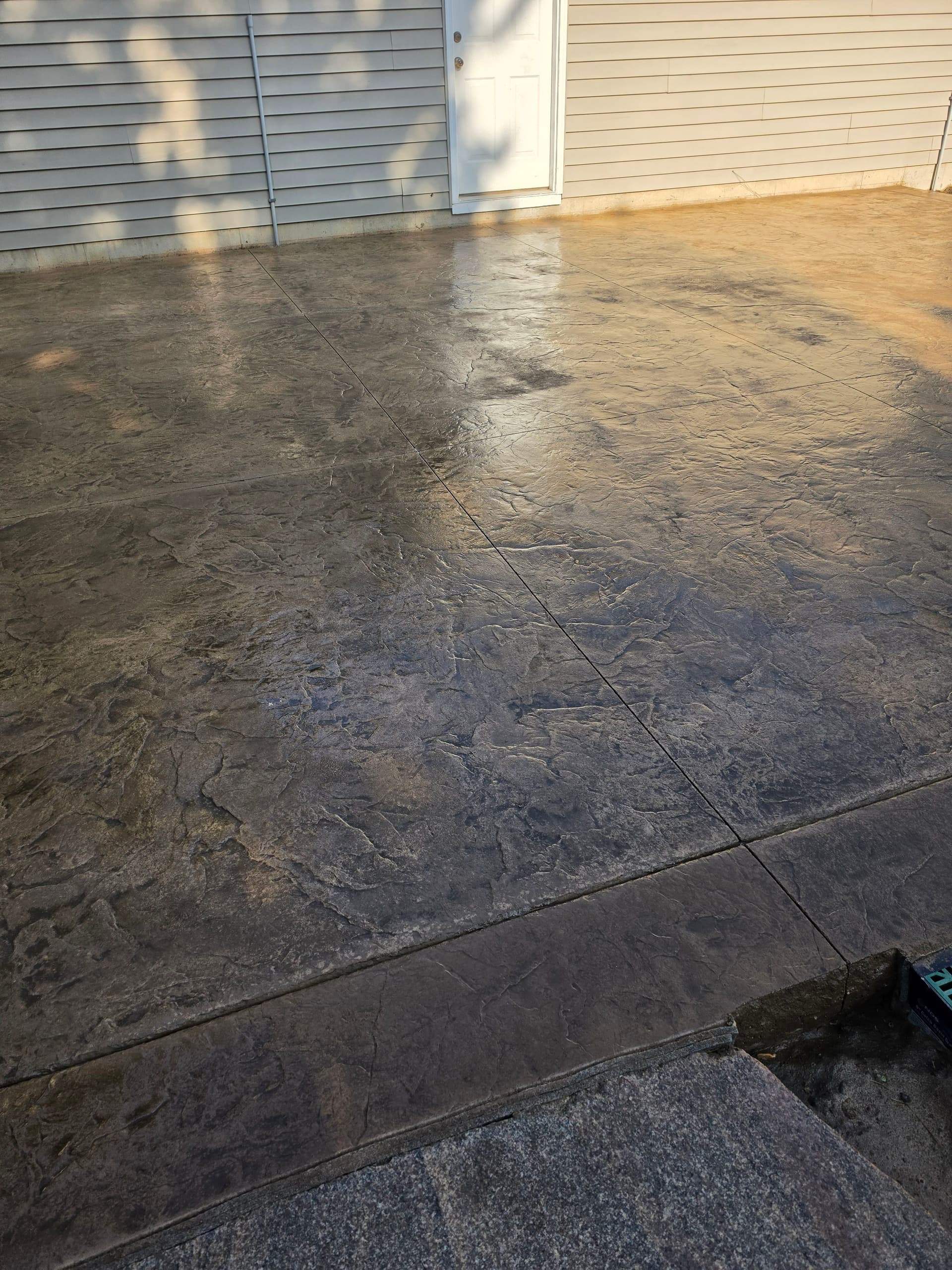 Roman Slate Stamped Patios and Broom Finish Concrete Wrapping Up the Week image