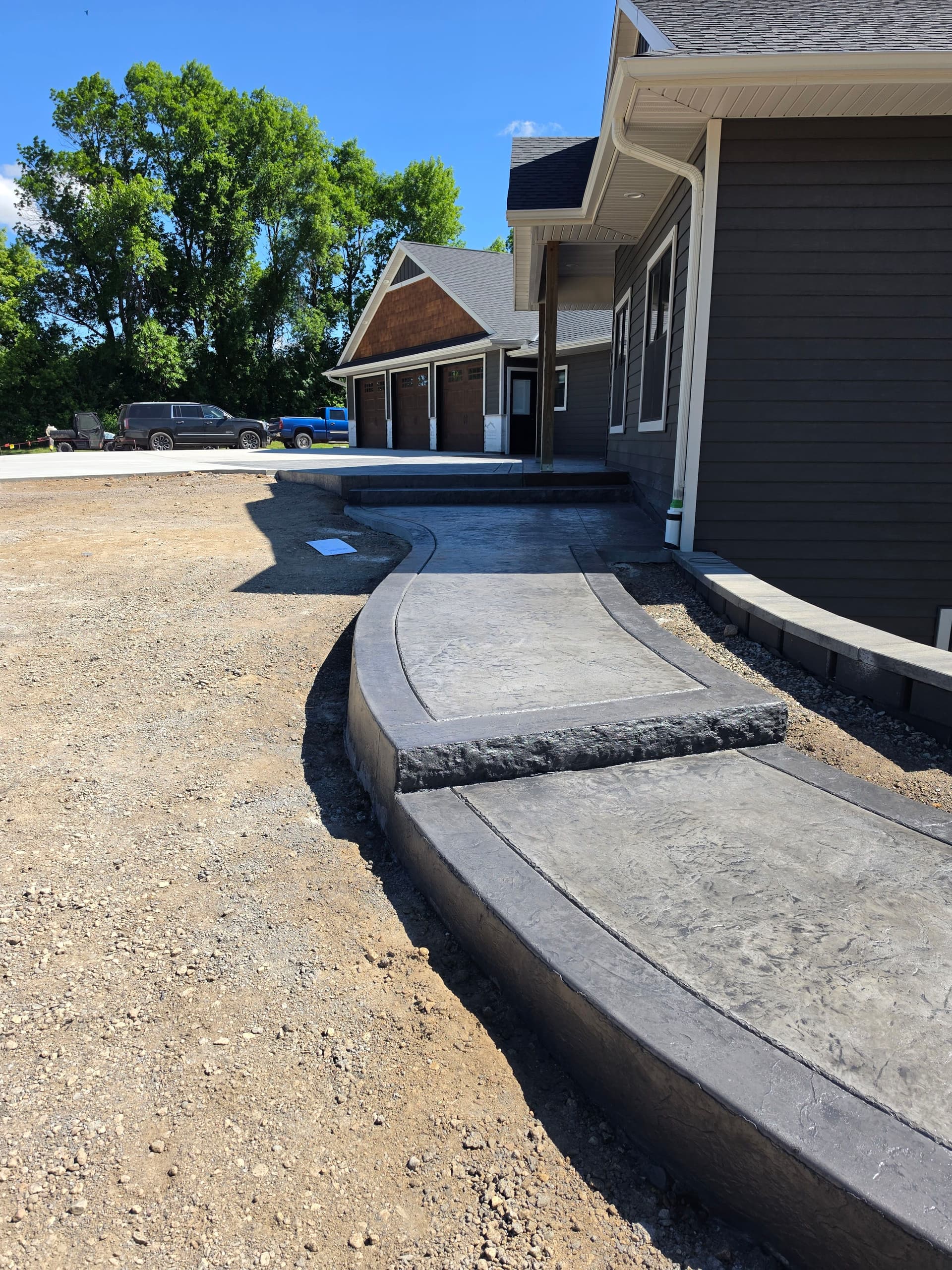 Gallery photos for Stamped Patios, Steps, Borders, and a Broom-Finish Driveway Built as One: Image #5