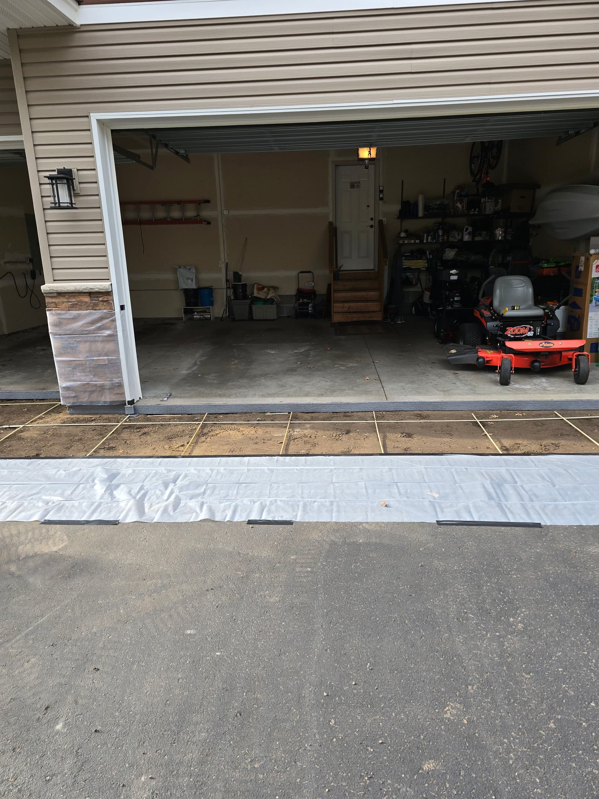 Gallery photos for Fresh Concrete Apron Poured Over a Settling Asphalt Driveway: Image #2